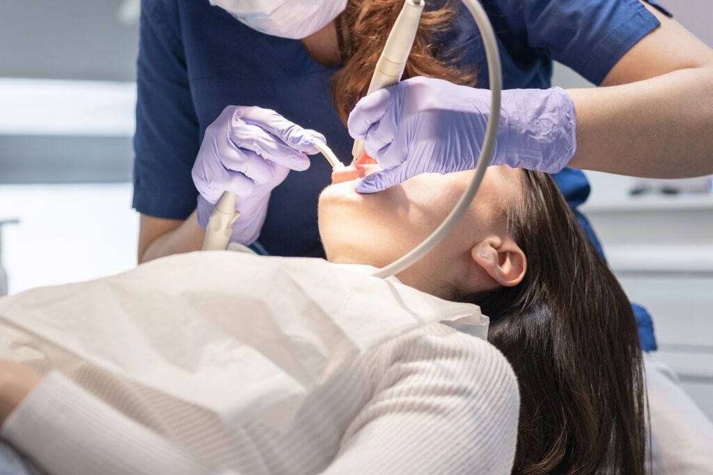 A profile shot of a woman receiving periodontal care in Craven County